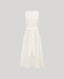 The Meryl Fitted Skater Dress In White. This dress features a full skirt and a 5cm wide belt, stab stitching detail, mother of pearl button and rouleaux loop fastening with invisible zip.