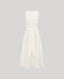 The Meryl Fitted Skater Dress In White. This dress features a full skirt and a 5cm wide belt, stab stitching detail, mother of pearl button and rouleaux loop fastening with invisible zip.
