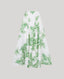 The Flora Full A-line Midi Skirt In Tropical Green with invisible zip at back and side pockets.