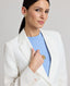Close-up of model wearing the Elizabeth Linen Jacket in White, featuring its notched lapel.