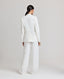 Back view of model wearing the Elizabeth Linen Jacket in White with matching Elizabeth straight relaxed trousers.