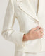 Button, princess seams and notched collar details of the cropped Meryl Cute Fitted Jacket In White.