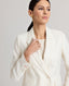 Peaked lapel detail of the fitted double breasted Corine Stripe Cotton Linen Jacket In Taupe.
