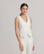 Model wearing the Meryl Fitted Waistcoat In White with contrast bottom buttonhole and covered buttons.