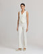 Model wearing the Meryl Fitted Waistcoat In White with contrast bottom buttonhole, covered buttons and matching Meryl slim straight trousers.