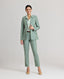 Model wearing the Jackie Wool Silk Turn-up Trousers in sea green—a modern take on traditional country wear, crafted from a luxurious blend of wool, silk, and linen, designed to stand out on a cold winter's day. Front view paired with the Jackie Wool Silk Jacket.