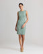 Model wearing the Jackie Wool Silk Shift Dress in sea green—a stand-out dress crafted from a blend of the finest wool, silk, and linen, featuring a simple structure and bold sea green colour. Front view.