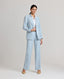 Model wearing the Tania Wool Blend Jacket in Blue Check. This single breasted longline jacket has a relaxed fit, under collar melton, contrast orange bottom buttonhole and a back vent. Shown here with the Tania Wool Blend Trousers.