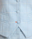 Close-up of the Tania Wool Blend Waistcoat In Blue Check featuring covered button and bottom stitch in orange contrast.