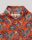 Collar and mother of pearl button details of the Sidney Paisley Liberty Silk Shirt Dress In Fiery Red Orange.