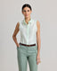 Model wearing the Eva Sleeveless Collared Shirt in aqua marineâ€â€a sleeveless shirt with a classic collar, designed with clean lines and a minimalist silhouette. Front view.