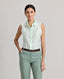 Model wearing the Eva Sleeveless Collared Shirt in aqua marine—a sleeveless shirt with a classic collar, designed with clean lines and a minimalist silhouette. Front view.