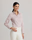 Model wearing the Emma Cotton Silk Fitted Shirt in taupe—a shirt crafted from the finest natural cotton and silk, featuring a streamlined silhouette with a relaxed fit, offering both style and practicality. Front view.
