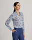 Model wears the relaxed Sophia shirt in blue made from 100% Liberty silk chiffon.