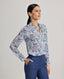 Model wears the relaxed Sophia shirt in blue made from 100% Liberty silk chiffon.