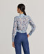 Back view of model wearing the relaxed Sophia shirt in blue made from 100% Liberty silk chiffon.