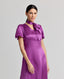 Model wearing the Nicole Liberty Silk Tie Neck Dress In Amethyst with detachable neck tie.