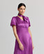 Model wearing the Nicole Liberty Silk Tie Neck Dress In Amethyst with detachable neck tie.