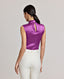 Back view of Model wearing the Nicole Liberty Silk Tie Neck Blouse In Amethyst. Showcasing a keyhole back opening with covered buttons, bound armholes and back waist darts for shaping.