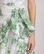 Close-up of model Wearing the Ella Tie Skirt in Tropical Green, featuring the side tie.