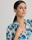 Close-up view of model wearing the Ivy Silk Cotton Blouse In Navy Floral, featuring neckline and stand collar.