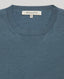 Close-up of the Sascha Short Sleeve Knitted Tee In Willow blue featuring the ribbed details at the neckline.