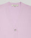 Close-up of our Sienna Classic Cardigan, featuring its neckline. This cardigan is a luxurious wardrobe staple with Mother of pearl buttons lending an elegant point of difference to this striking and feminine piece. Crafted with the finest blend of cotton and cashmere.