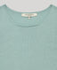 Close-up of our Sabrina Crew Neck Tank in sage, featuring the classic round neckline.