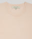 Close-up view of our Selina Short Sleeve Knitted Tee, picot edging neckline detail - designed in a timeless neural colour-way, a seasonally transitional piece, designed for longevity. A perfect fit for the modern wardrobe with picot edging at the neck and scallop at the cuff. Made in a luxurious blend of cotton and cashmere.