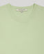 Close-up of our Selina Short Sleeve Knitted Tee, featuring its picot neckline. This tee is designed in an elegant pistachio. A perfect fit for the modern wardrobe with picot edging at the neck and scallop detailing at cuff. Made in a luxurious blend of cotton and cashmere.