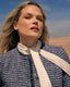 model in silk blouse and boucle jacket 