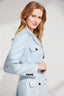 Model wearing Light blue safari jacket with tortoiseshell buttons on a plain background