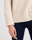 Superfine Lambswool Chunky Roll Neck Jumper, Almond | Really Wild Clothing | Studio Model Ribbing Detail