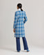 Model wearing The Lady Check Wool Coat in Butterfly Blue—a tailored, heritage-style coat, back view.