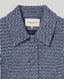 Collar and self-covered buttons detail of Elinor Short Tweed Jacket In Indigo Denim.