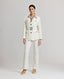 Model wearing the Meryl Safari Jacket In White with Meryl slim straight trousers.