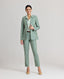 Model wearing the Jackie Wool Silk Turn-up Trousers in sea greenâ€”a modern take on traditional country wear, crafted from a luxurious blend of wool, silk, and linen, designed to stand out on a cold winter's day. Front view paired with the Jackie Wool Silk Jacket.
