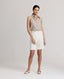 Model wearing the Corine Tailored Stripe Shorts in Taupe with pleat details at the front. 