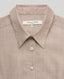 Close-up of our Diane Sleeveless Collared Shirt in Taupe, highlighting the collar and button details. 
