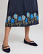 Juliette Floral Silk Shirt Dress In Navy with details of the blue floral printed border above hem.