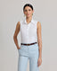 Model wearing the Eva Sleeveless Collared Shirt in whiteâ€”a versatile, sleeveless shirt with a classic collar, designed for effortless layering and suitable for any occasion. Front view.
