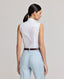 Model wearing the Eva Sleeveless Collared Shirt in white—a versatile, sleeveless shirt with a classic collar, designed for effortless layering and suitable for any occasion. Back view of the shirt.