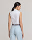 Model wearing the Eva Sleeveless Collared Shirt in whiteâ€”a versatile, sleeveless shirt with a classic collar, designed for effortless layering and suitable for any occasion. Back view of the shirt.
