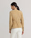 Model wearing the Robyn Suede Jacket in camel—a timeless and luxurious outerwear piece crafted from 100% suede leather, featuring a flattering fit and collarless design for a modern, feminine twist. Back view.