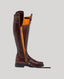 Brown Leather Boots with buckle opening and reinforced zip undone showing the orange lining 