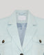 Light blue blazer with brand label on a light gray background