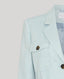 Light blue blazer with tortoiseshell buttons on a light gray background