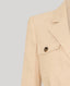 Close-up on details on beige jacket on grey background 