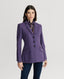 Model wearing Barnsley Merino Wool Jacket in Purple with silk blouse 