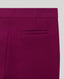 Close-up of a fabric with a pocket detail on a light gray background